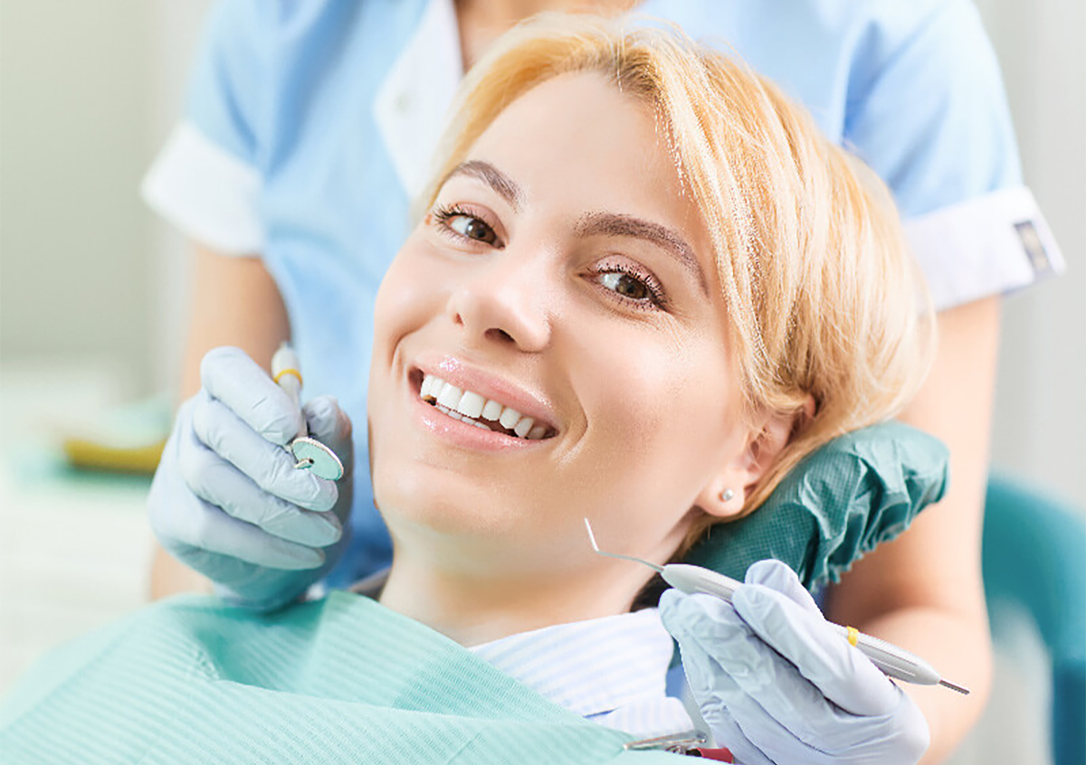 Female patient at the dentist smiling at the camera