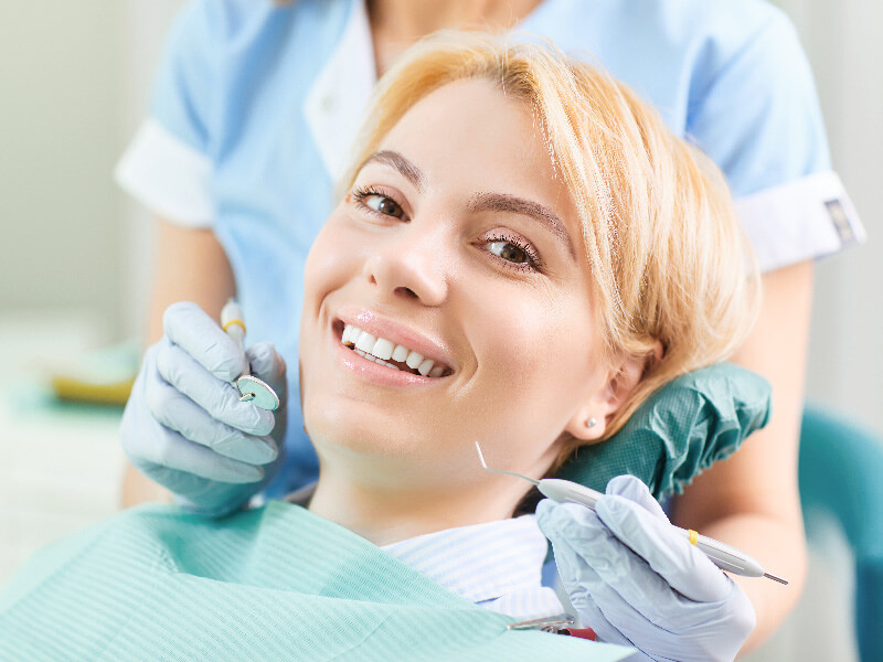 Female patient at the dentist smiling at the camera